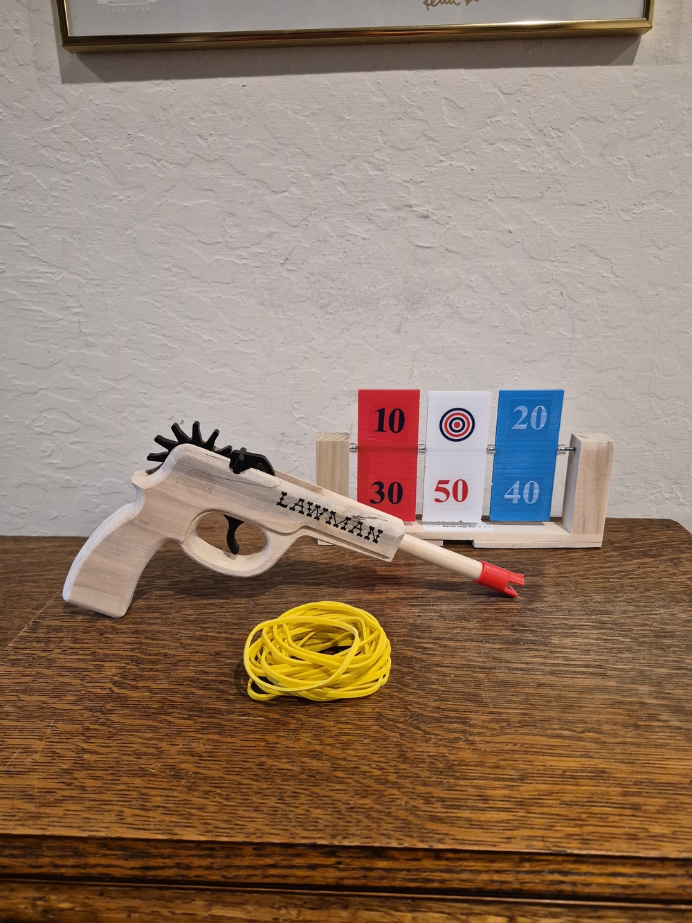 Magnum Enterprises Lawman Rubber Band Gun, a 12-shot Semi-automatic Wooden Toy